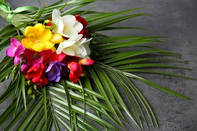 Photo of Beautiful freesia bouquet on grey background