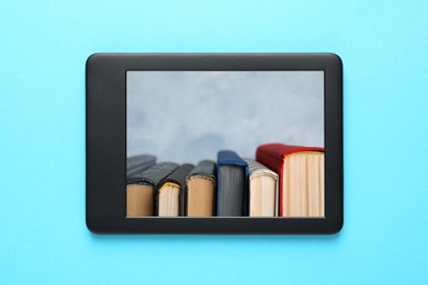 Modern e-book reader on turquoise background, top view