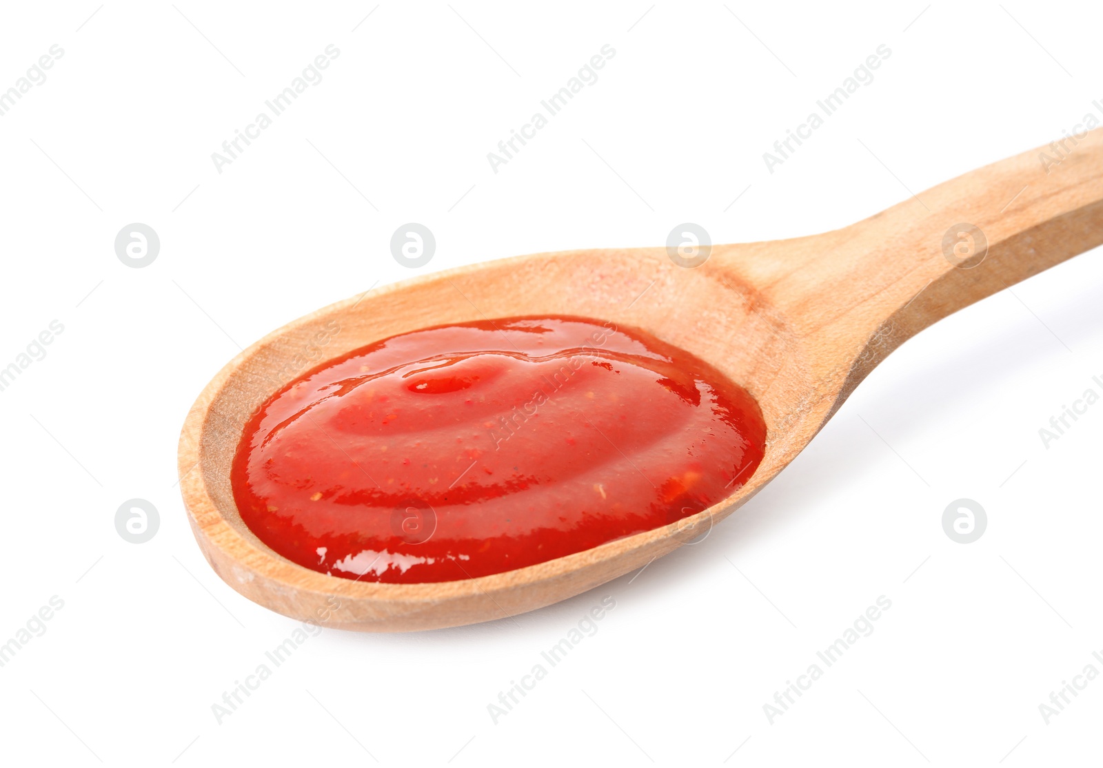 Photo of Spoon of tasty tomato sauce isolated on white