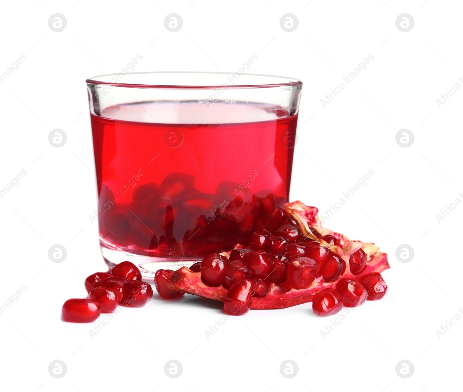 Photo of Pomegranate seeds and tasty jelly dessert in glass on white background