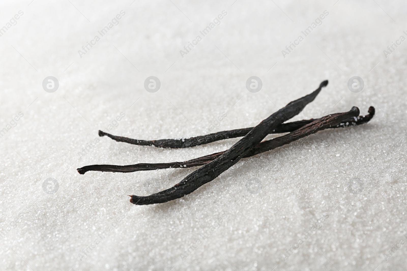 Photo of Vanilla sugar and sticks, closeup