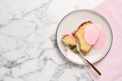 Photo of Delicious cake with pink glaze served on white marble table, flat lay. Space for text