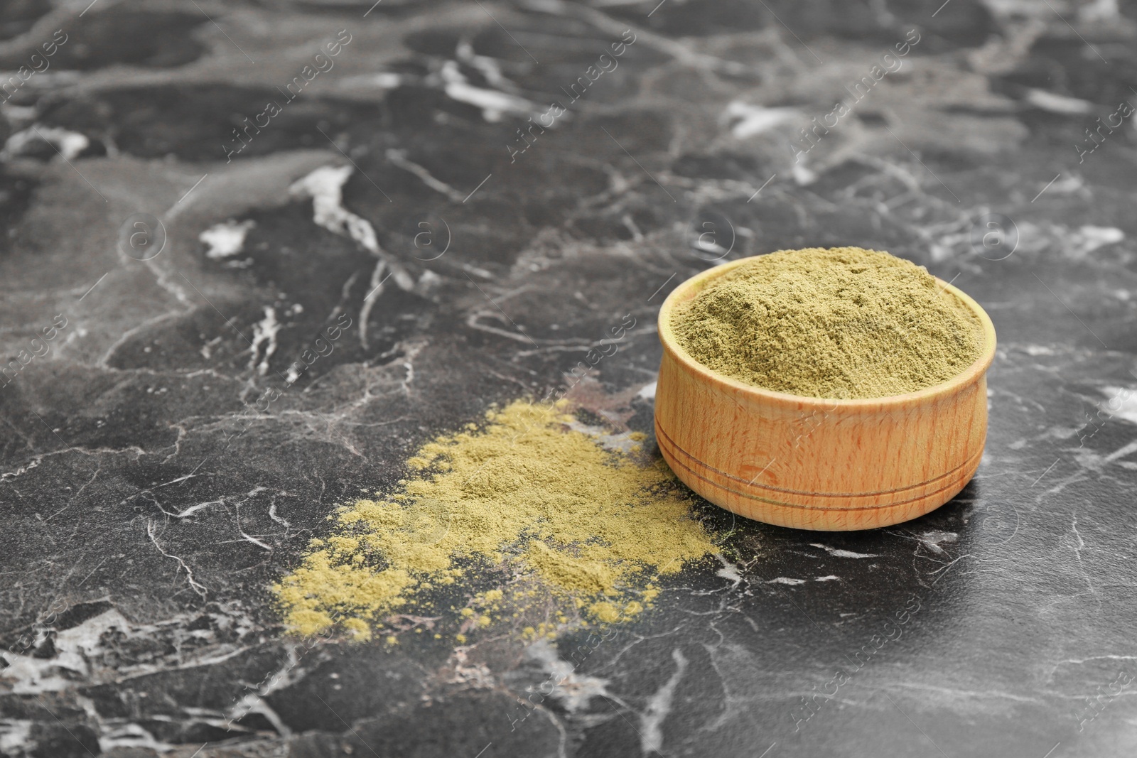 Photo of Hemp protein powder in bowl on table. Space for text