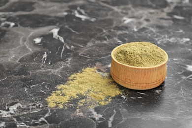 Photo of Hemp protein powder in bowl on table. Space for text