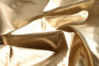 Photo of Texture of beautiful golden fabric as background, closeup