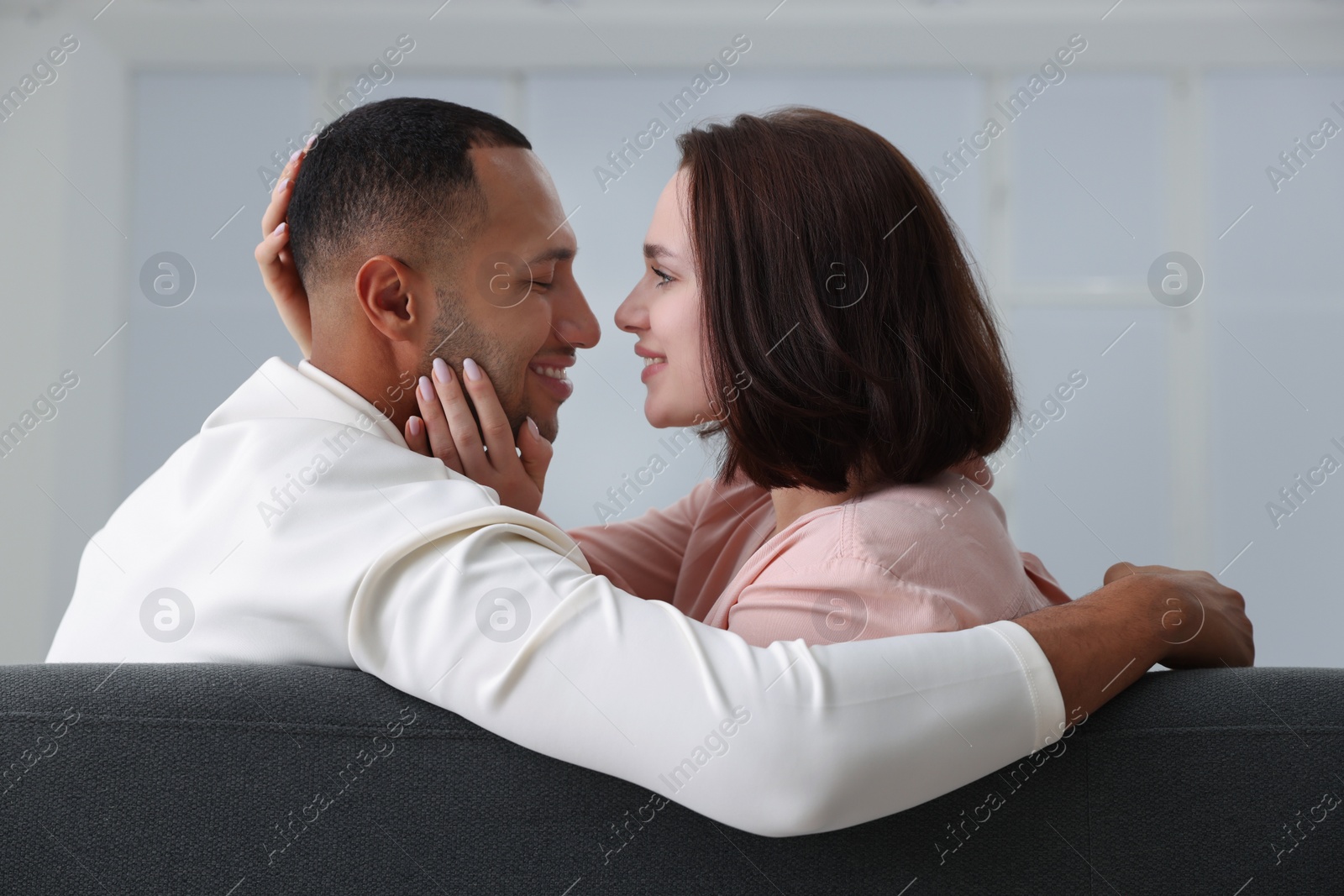 Photo of Dating agency. Happy couple enjoying time together at home