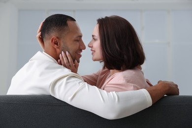 Photo of Dating agency. Happy couple enjoying time together at home