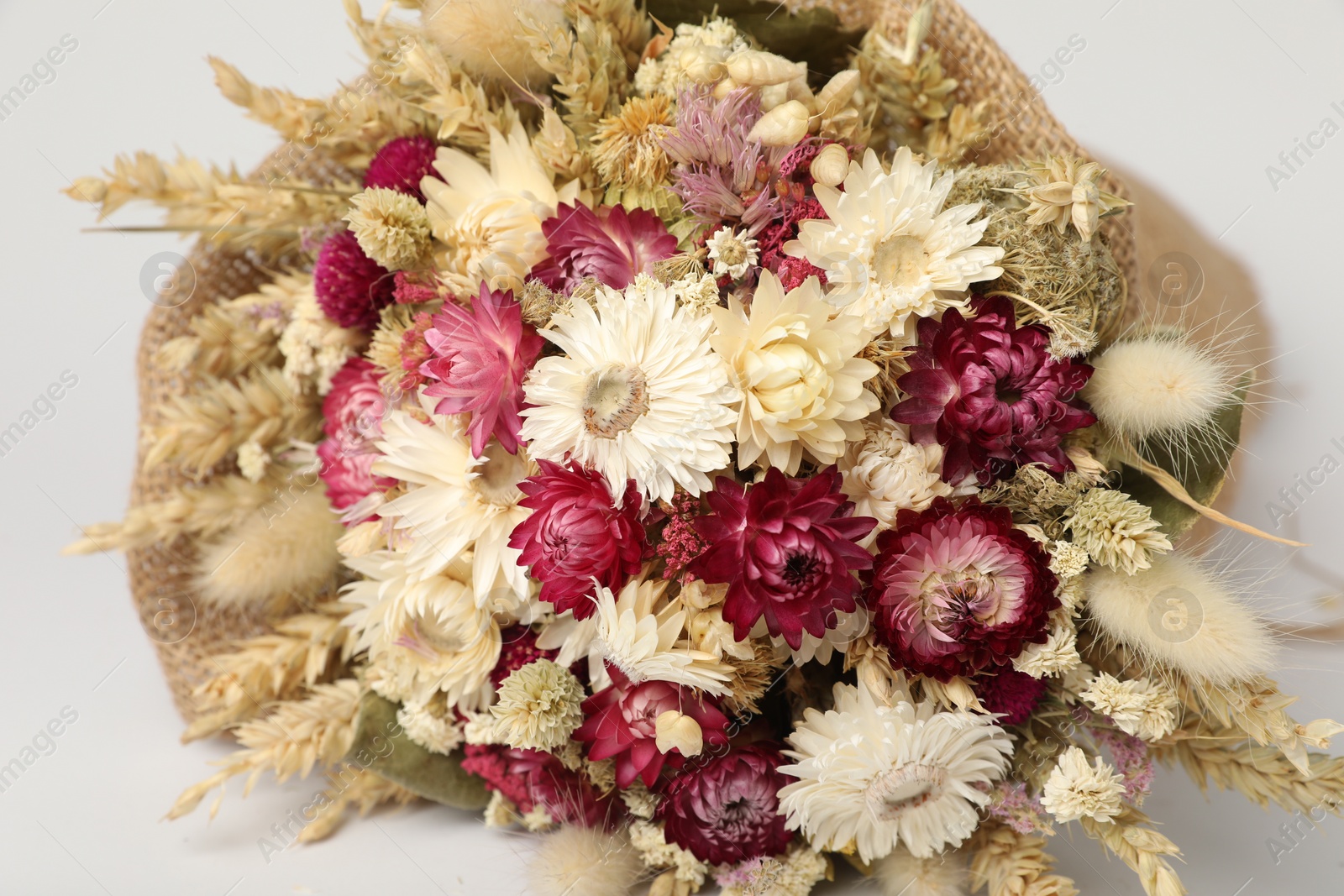 Photo of Beautiful bouquet of dry flowers on white background, closeup