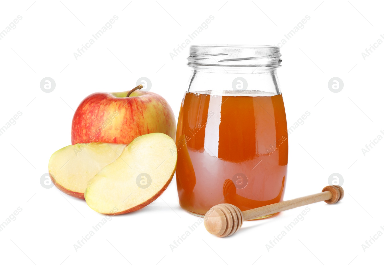 Photo of Glass jar with sweet honey and apples on white background