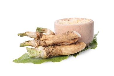 Grated and cut horseradish roots and leaf isolated on white