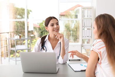 Photo of Patient having appointment with doctor in hospital