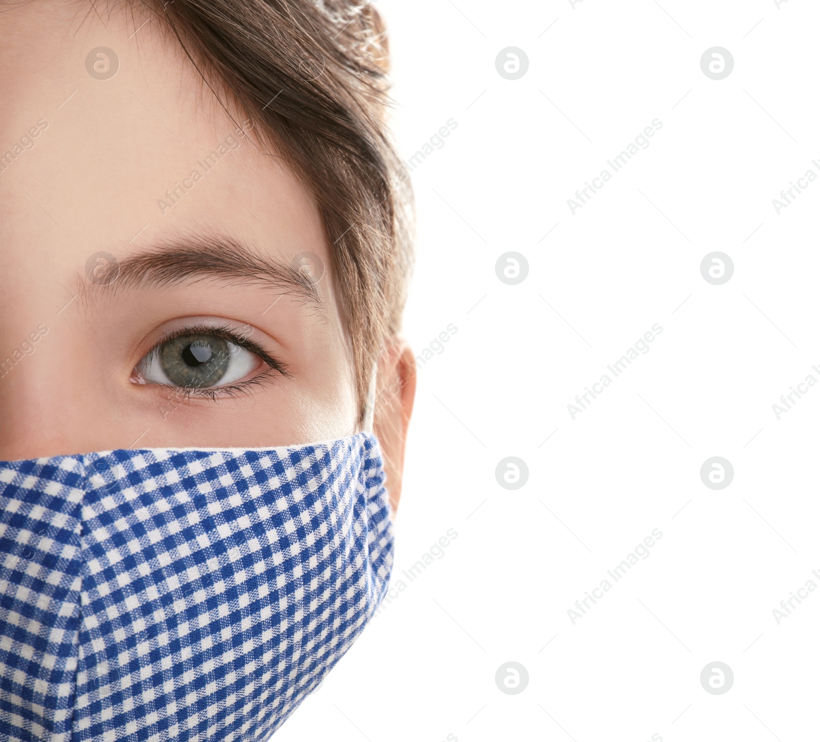 Photo of Girl wearing protective mask on white background, closeup. Child's safety from virus