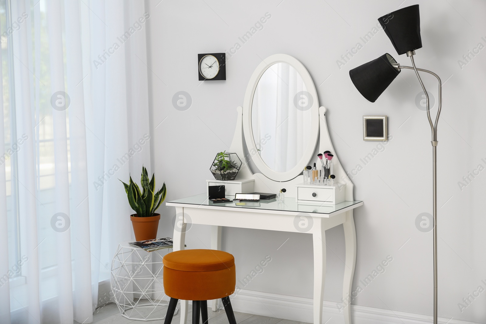 Photo of Dressing table with mirror in stylish room interior