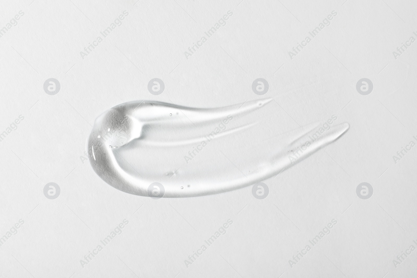 Photo of Sample of cosmetic gel on white background, top view