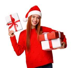 Photo of Young woman in red sweater and Santa hat with Christmas gifts on white background