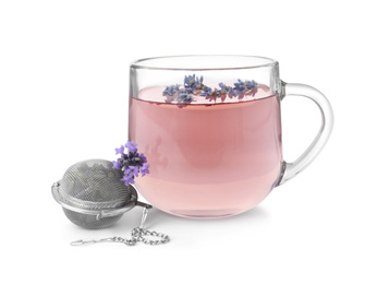Fresh delicious tea with lavender, strainer and beautiful flowers on white background