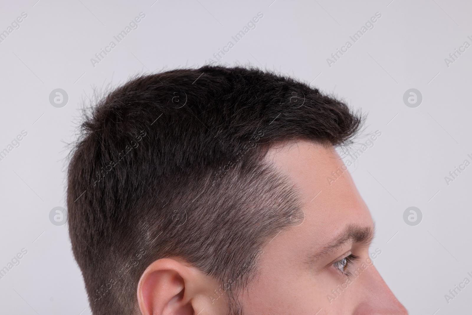 Photo of Man with healthy hair on white background, closeup