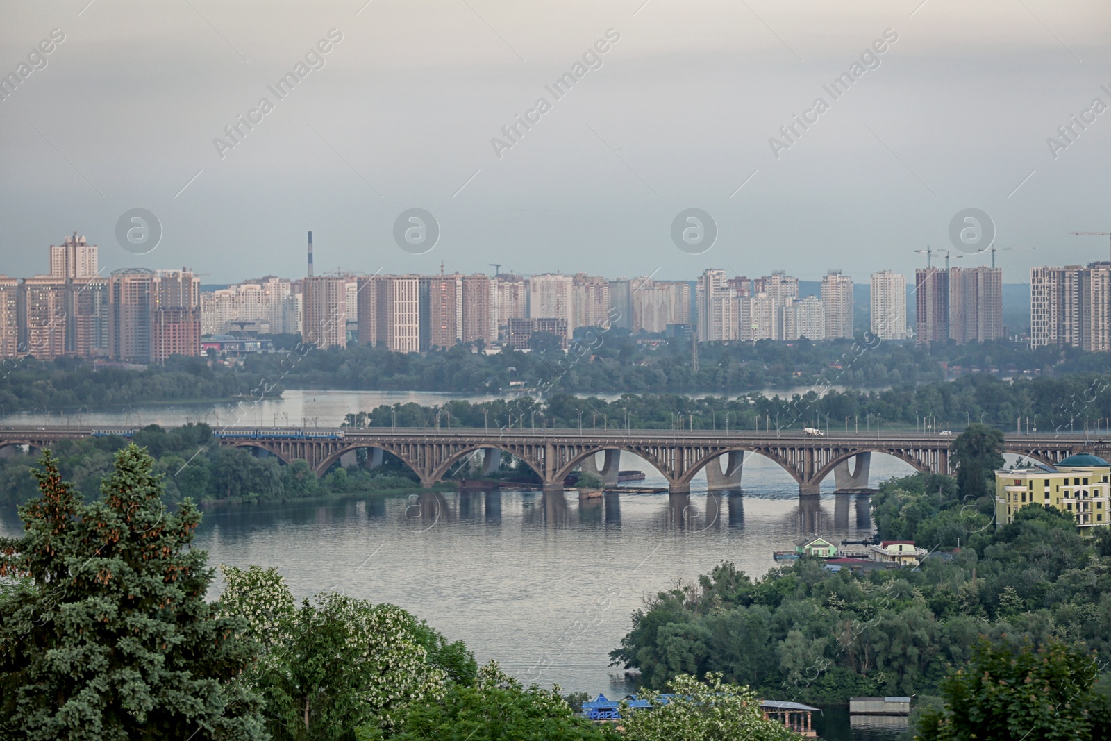 Photo of KYIV, UKRAINE - MAY 23, 2019: Beautiful view of Paton bridge over Dnipro river