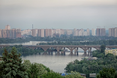 KYIV, UKRAINE - MAY 23, 2019: Beautiful view of Paton bridge over Dnipro river