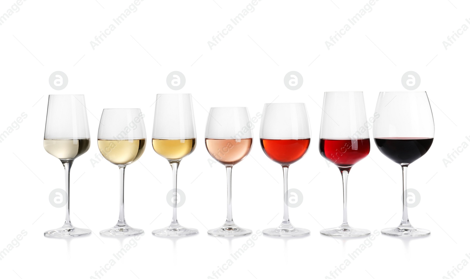 Photo of Row of glasses with different wines on white background