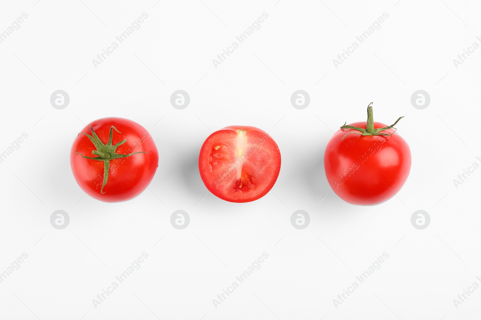 Photo of Whole and ripe red tomatoes on white background, top view