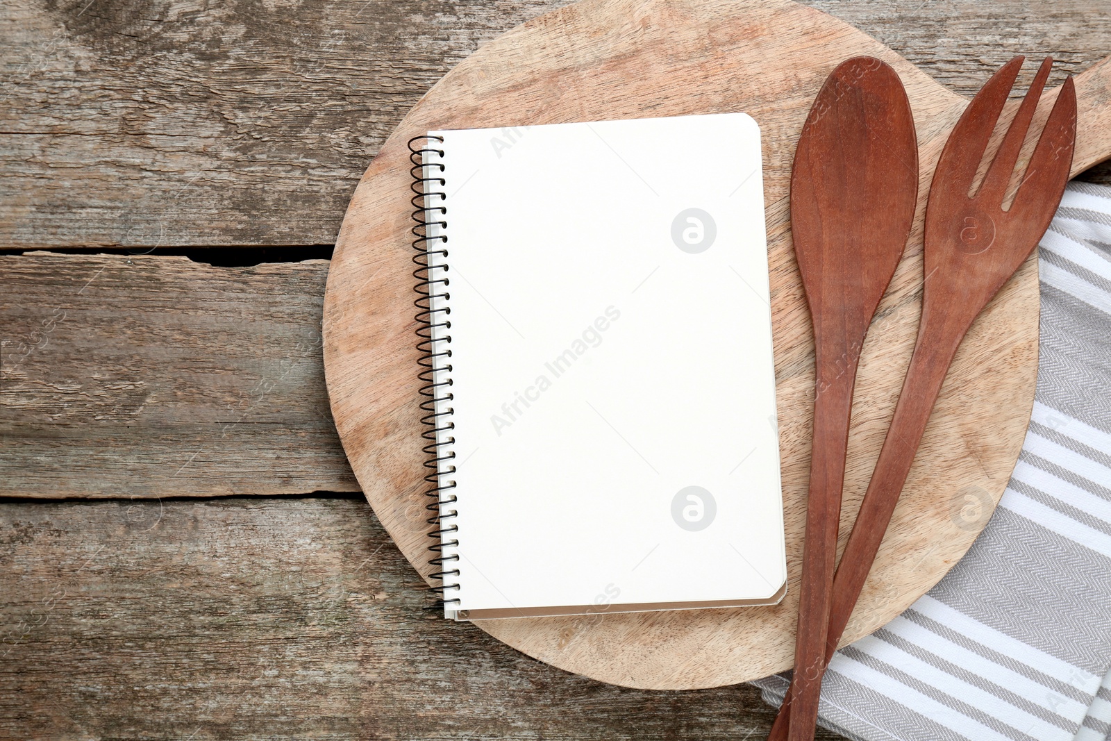 Photo of Blank recipe book and kitchen utensils on old wooden table, flat lay. Space for text