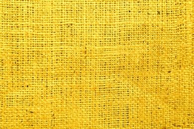 Image of Texture of yellow burlap fabric as background, top view