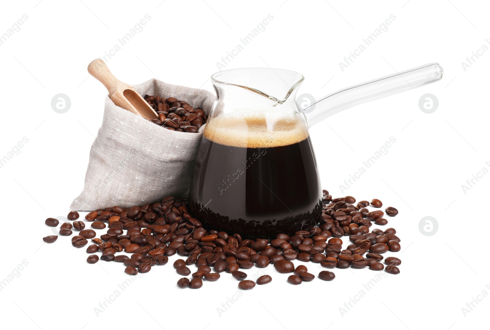 Photo of Glass turkish coffee pot with hot drink and beans on white background