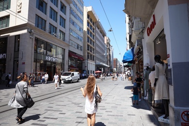 Photo of ISTANBUL, TURKEY - AUGUST 10, 2019: Beautiful city street with people on sunny day