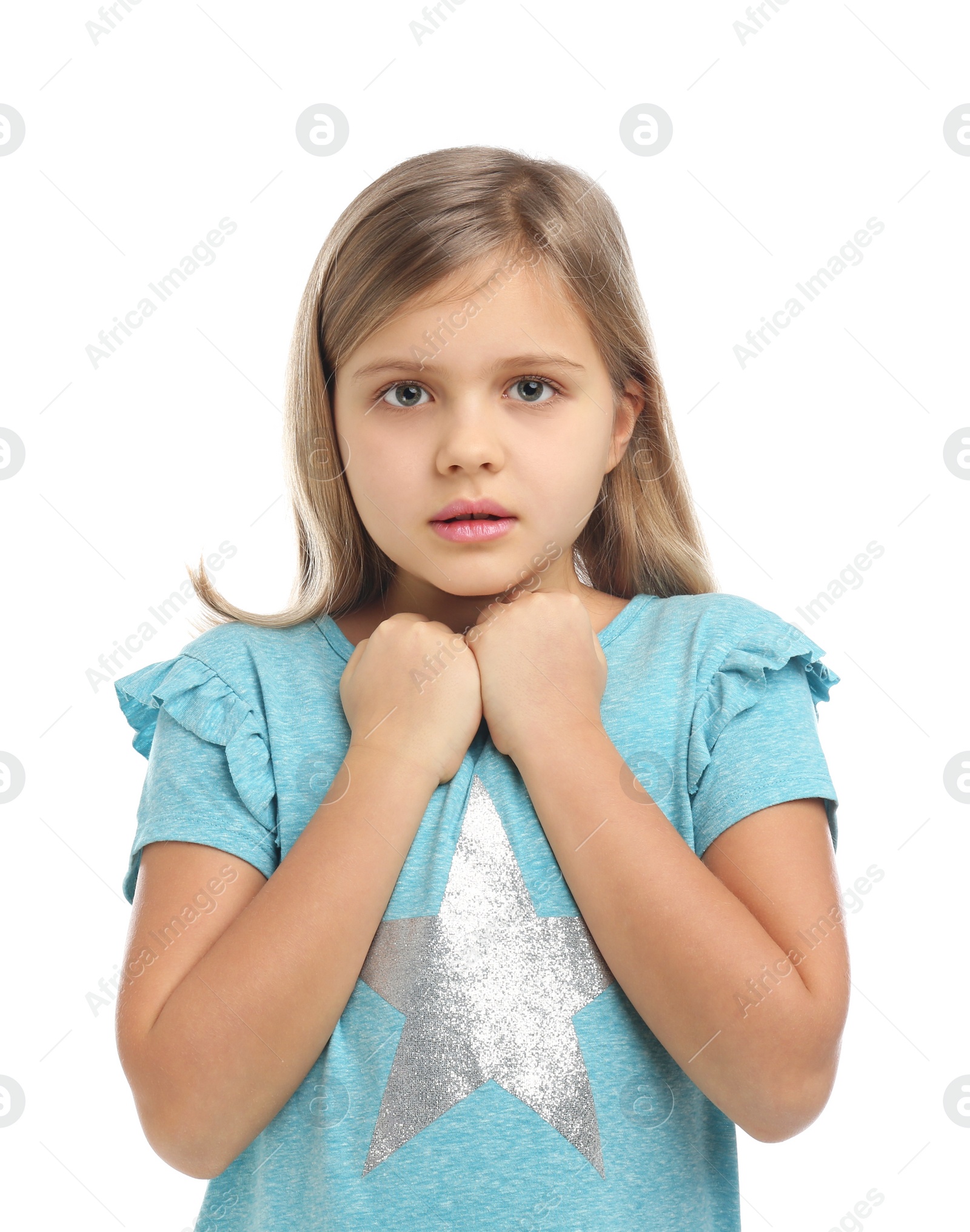 Photo of Scared little girl wearing casual outfit on white background