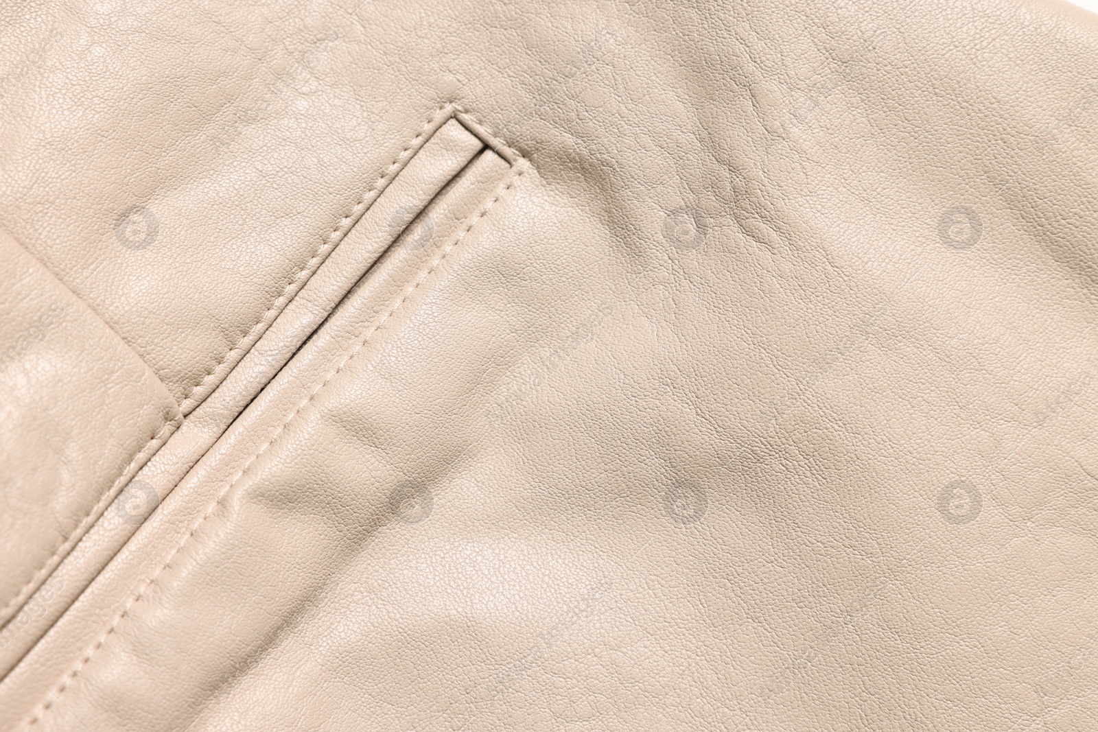 Photo of Beige natural leather with seams as background, top view