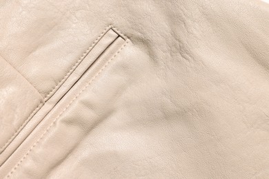 Photo of Beige natural leather with seams as background, top view