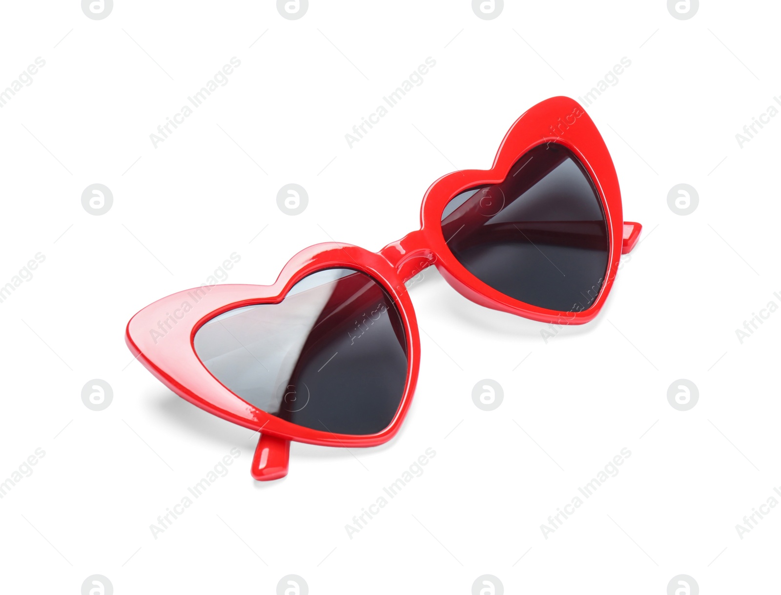 Photo of Stylish heart shaped glasses on white background