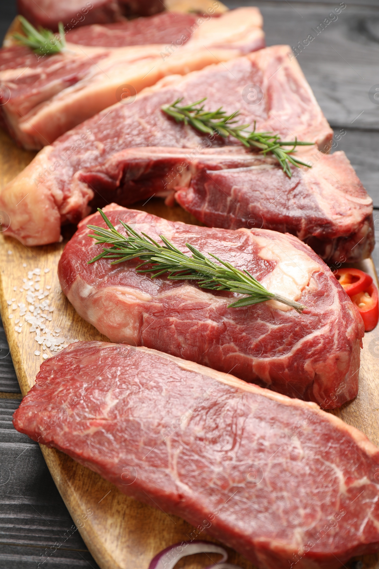 Photo of Pieces of raw beef meat on table, closeup