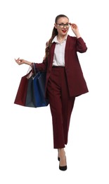 Photo of Stylish young businesswoman with shopping bags on white background