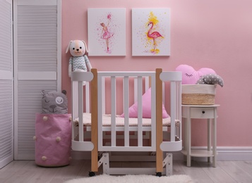 Baby room interior with beautiful pictures on wall