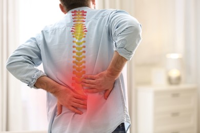 Image of Man suffering from back pain at home, closeup. Bad posture problem
