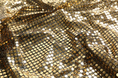Closeup view of golden shiny sequin fabric as background