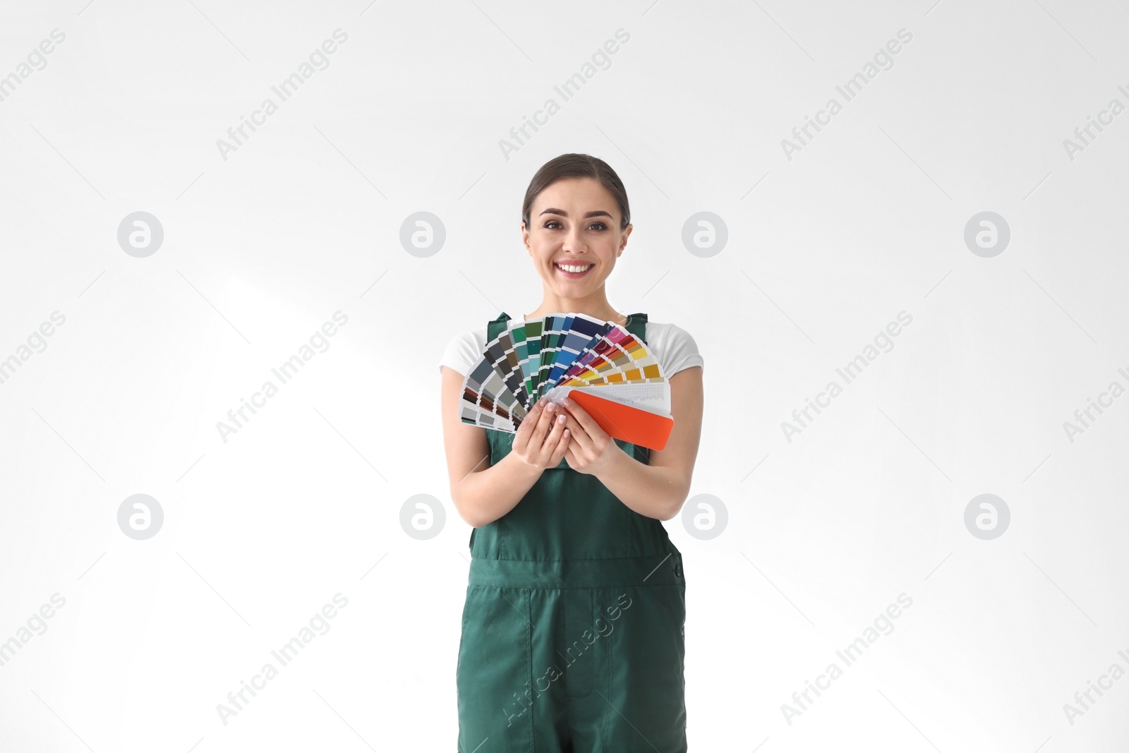 Photo of Female decorator with color palette on white background