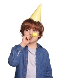 Photo of Birthday celebration. Cute little boy in party hat with blower on white background