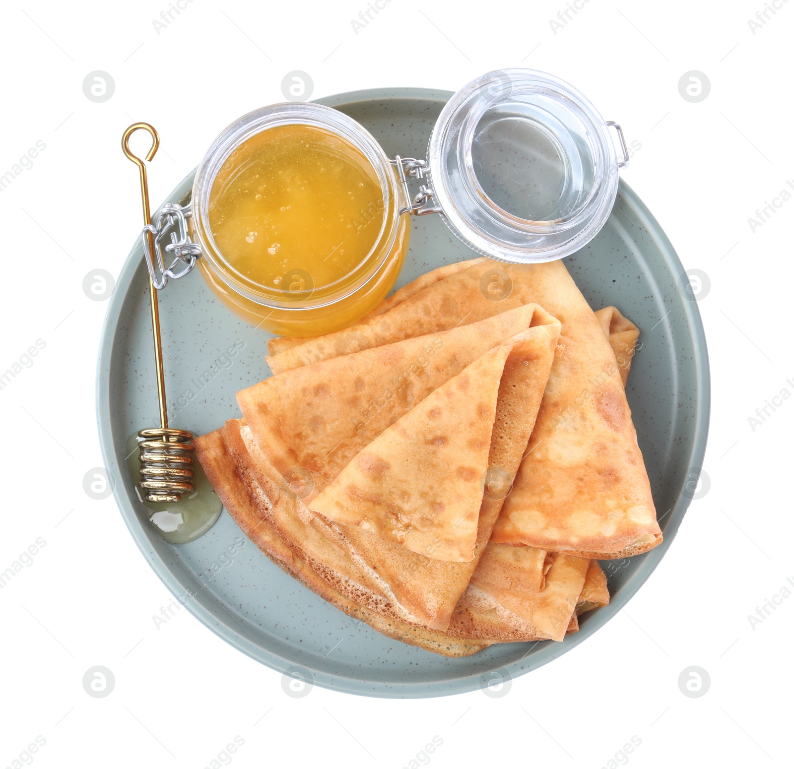 Photo of Delicious crepes with honey on white background, top view