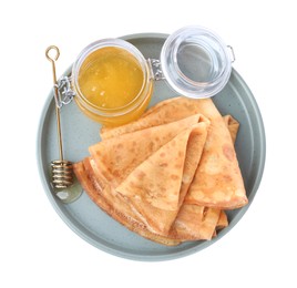 Photo of Delicious crepes with honey on white background, top view