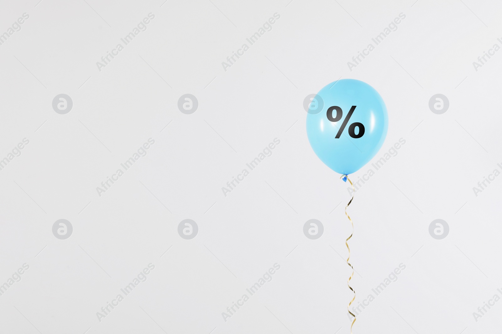 Image of Discount offer. Light blue balloon with percent sign on white background, space for text