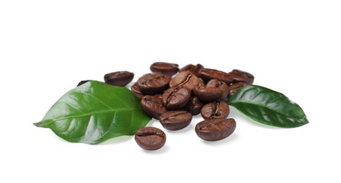 Photo of Roasted coffee beans with fresh leaves on white background