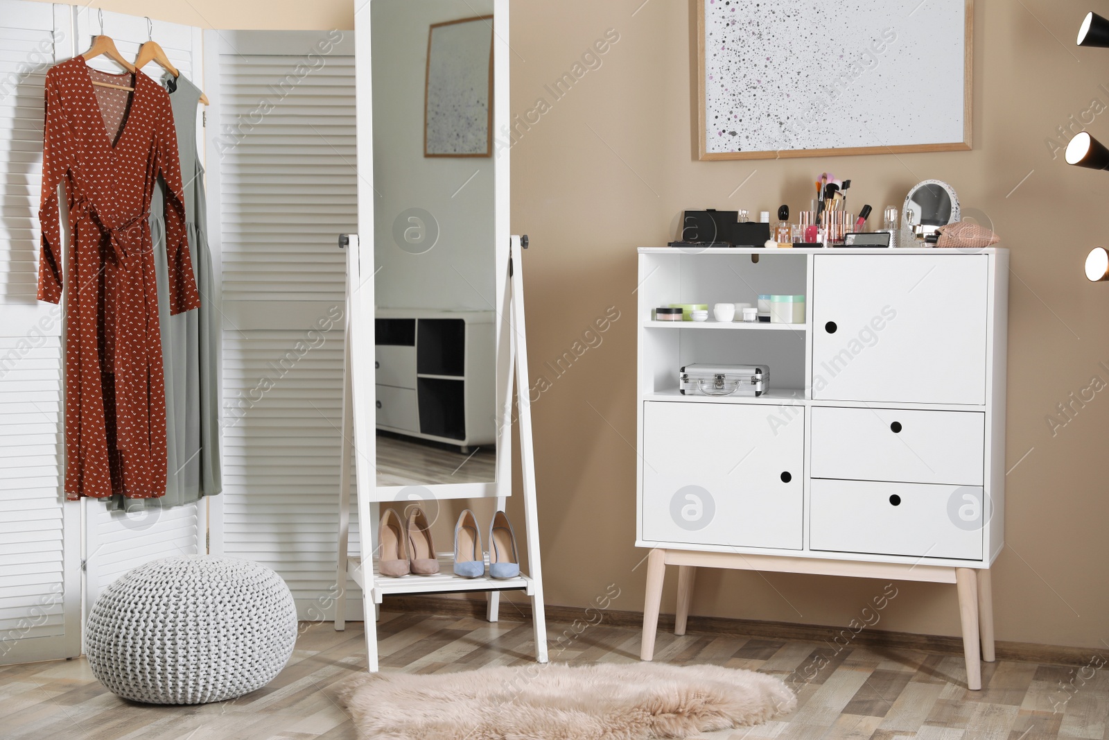 Photo of Interior of beautiful room with dressing table near wall