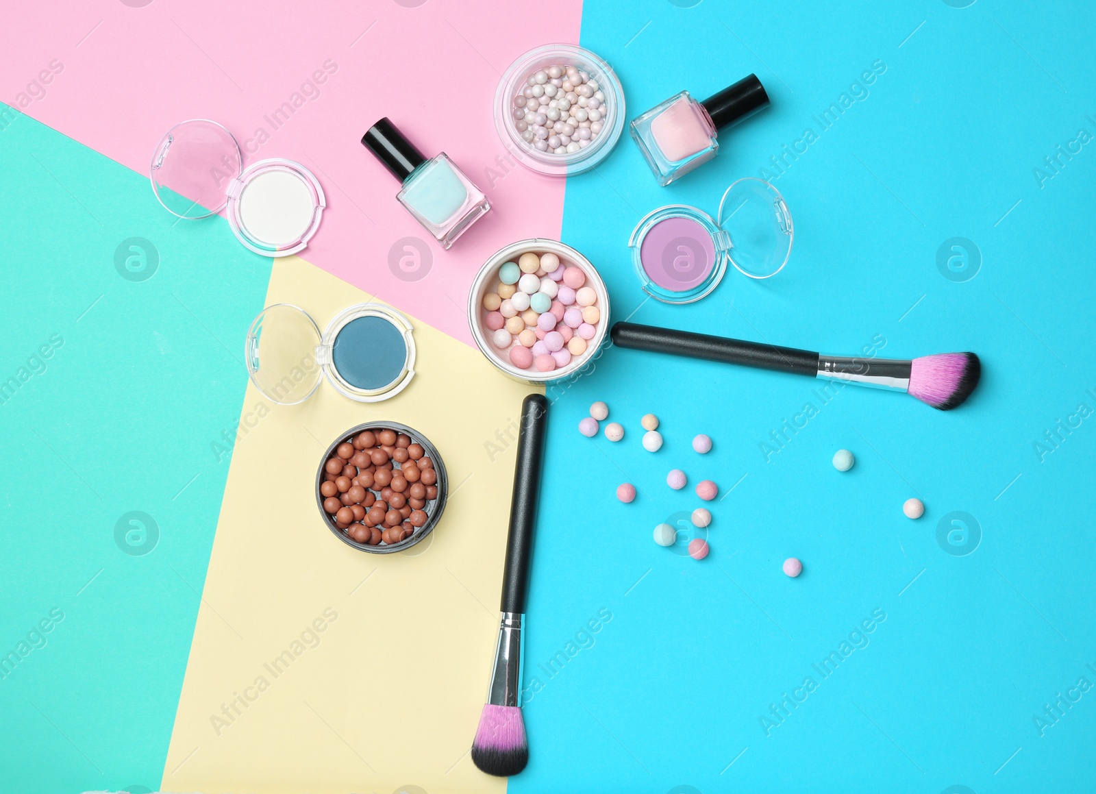 Photo of Decorative makeup products on color background