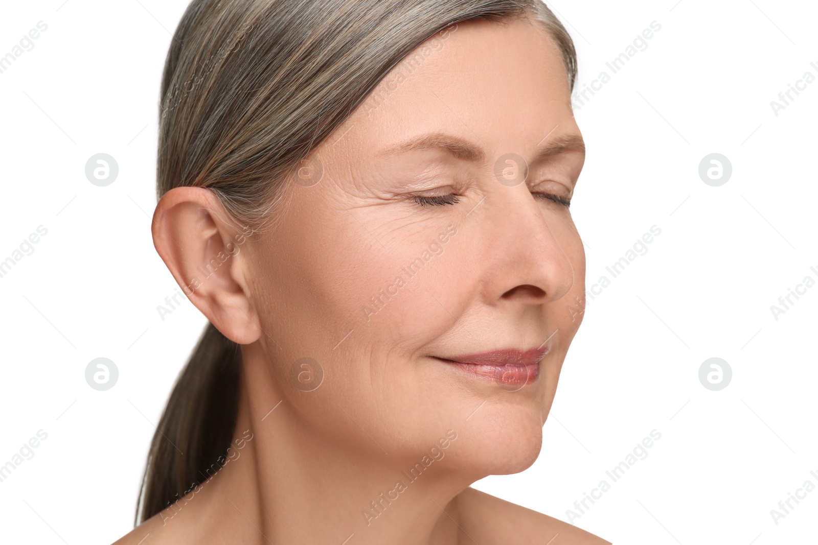 Photo of Portrait of senior woman with aging skin on white background. Rejuvenation treatment