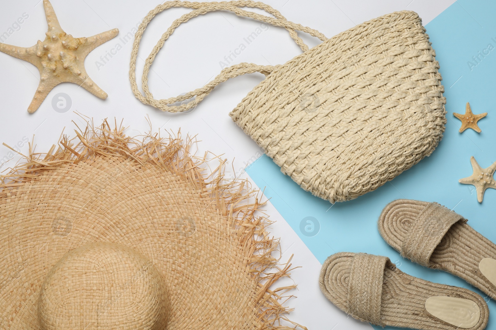 Photo of Stylish bag and beach accessories on color background, flat lay