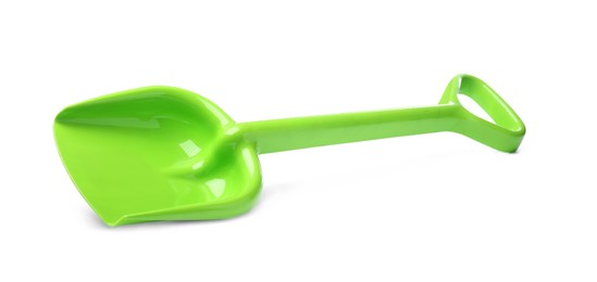 Photo of Green plastic toy shovel isolated on white