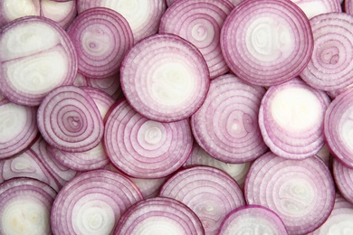 Photo of Ripe red onions as background